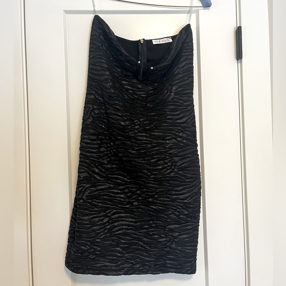 Short black rouched strapless dress. Has been dry cleaned. Size small